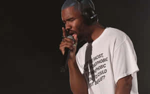 Celebrity Rapper Frank Ocean Working On His Laptop Wallpaper