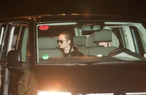 Celebrity Sightingin Vehicleat Night Wallpaper