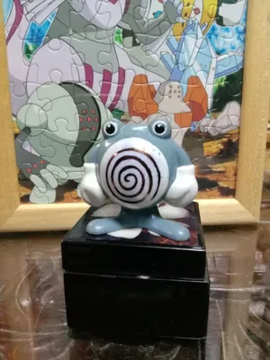 Ceramic Poliwhirl Statue Wallpaper