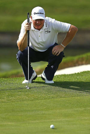 Chad Campbell Focused On His Ball In Golf Game Wallpaper