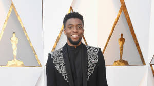 Chadwick Boseman Gold Oscar Trophy Wallpaper