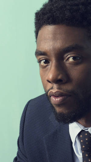 Chadwick Boseman Textured Blue Suit Wallpaper