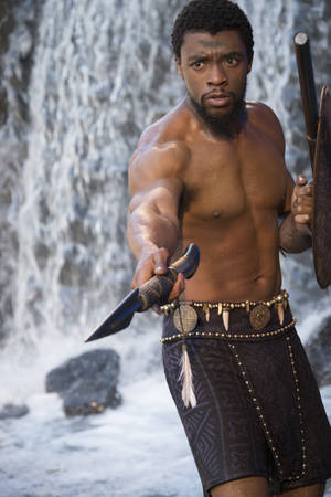 Chadwick Boseman Tribal Spear And Shield Wallpaper