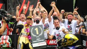 Champion Athlete At The Finish Line Wallpaper