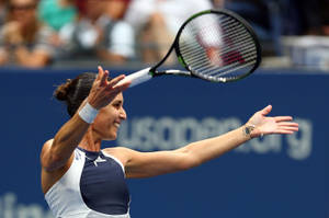 Champion Flavia Pennetta Celebrating Her Victory On The Court Wallpaper