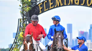 Champion Jockey Jamie Kah In Action On The Racecourse Wallpaper
