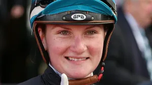 Champion Jockey Jamie Kah Looking Confident On Horseback Wallpaper