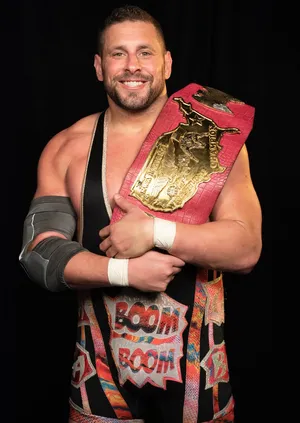 Champion Wrestlerwith Title Belt Wallpaper