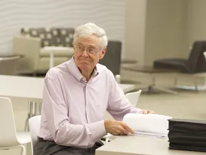 Charles G. Koch In Thoughtful Contemplation Wallpaper