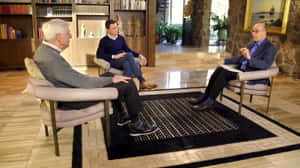 Charles G. Koch Interview With Two People Wallpaper