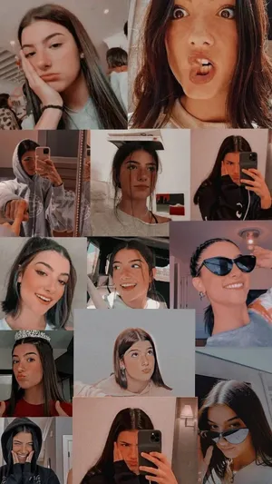 Charli And Addison Stood Together On Top Of A Mountain Wallpaper