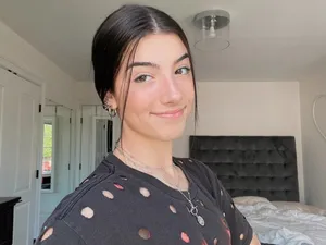 Charlie Damelio Beaming With Joy Wallpaper