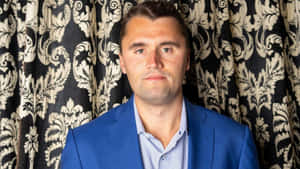 Charlie Kirk Portrait Blue Suit Wallpaper