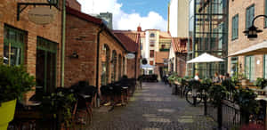 Charming Cobblestone Street Halmstad Sweden Wallpaper