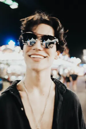 Chase Hudson Aviator Glasses And Unbuttoned Shirt Wallpaper