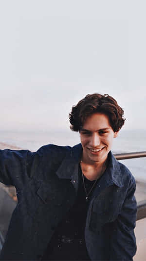 Chase Hudson Taking A Leisurely Walk In The Park Wallpaper