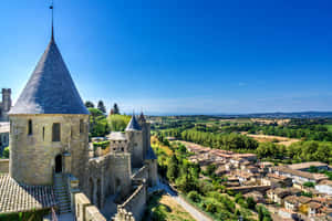 Chateau Comtal And Houses In Carcassonne Wallpaper