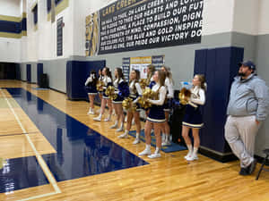 Cheerleaders Sideline Support During Game Wallpaper