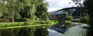 Chelmsford River Viewwith Modern Building Wallpaper