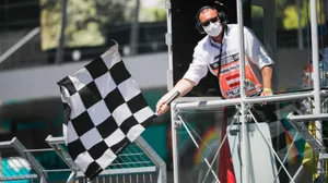Chequered Flag Waving At Finish Line Wallpaper