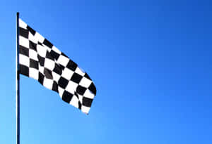 Chequered Flag Waving At The Finish Line Wallpaper