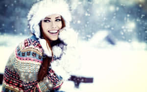 Chic Woman Embracing Winter Style Wallpaper