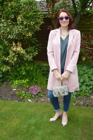 Chic Woman In Vibrant Pink Coat Wallpaper