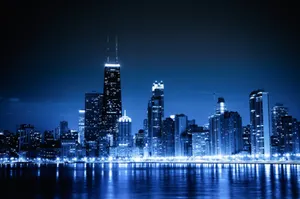 Chicago City Night Skyline With Blue Lights Wallpaper