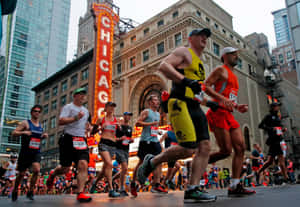 Chicago Marathon Runners Near Sign Wallpaper