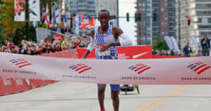 Chicago Marathon Winner Crossing Finish Line Wallpaper