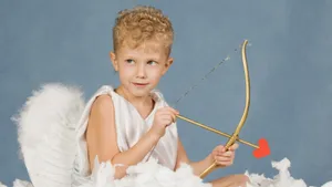 Child Dressed As Cupid Wallpaper
