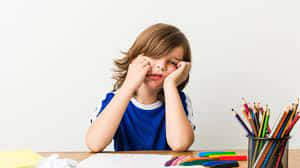 Child Upset Doing Homework Wallpaper