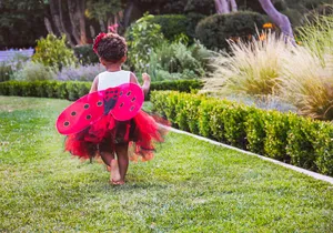 Childin Ladybug Costume Runningin Garden Wallpaper