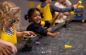 Children Enjoying Interactive Exhibitat Science Centre Wallpaper