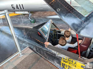 Children Exploring Cockpit Museum Of Flight Wallpaper