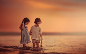 Children Taking A Dip In The Water Wallpaper