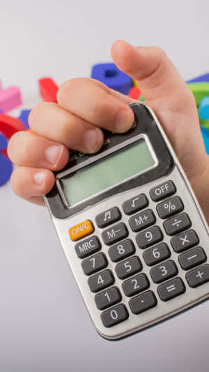 Childs Hand Holding Calculator Wallpaper