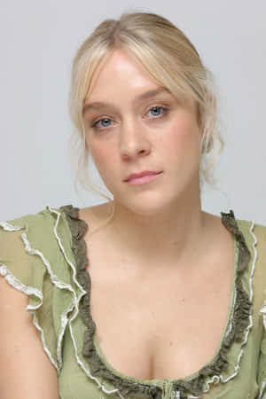 Chloë Sevigny Striking A Pose In A Stylish Ensemble Wallpaper