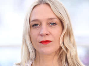 Chloë Sevigny Striking A Pose In A Stylish Outfit Wallpaper