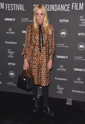 Chloë Sevigny Striking A Pose In Front Of The Camera Wallpaper