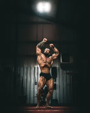 Chris Bumstead Vacuum Bodybuilding Pose Wallpaper
