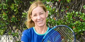 Chris Evert Smiling In Blue Wallpaper