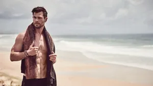 Chris Hemsworth Showing Off His Fit Physique At The Beach Wallpaper