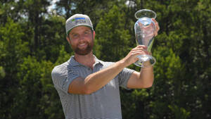 Chris Kirk Posing With Trophy Wallpaper