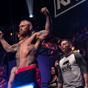 Chris Leben Demonstrating Well-built Physique And Unique Tattoos Wallpaper