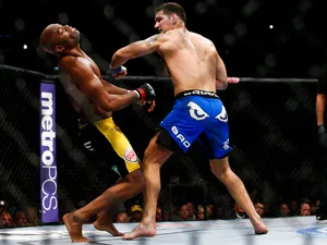 Chris Weidman Capturing Victory Over Anderson Silva Wallpaper