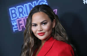 Chrissy Teigen Red Blazer Event Wallpaper