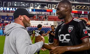 Christian Benteke Shaking Hands With Wayne Rooney Wallpaper