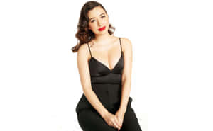 Christian Serratos Striking A Pose During A Photoshoot Wallpaper