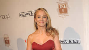 Christine Taylor Posing At An Event Wallpaper